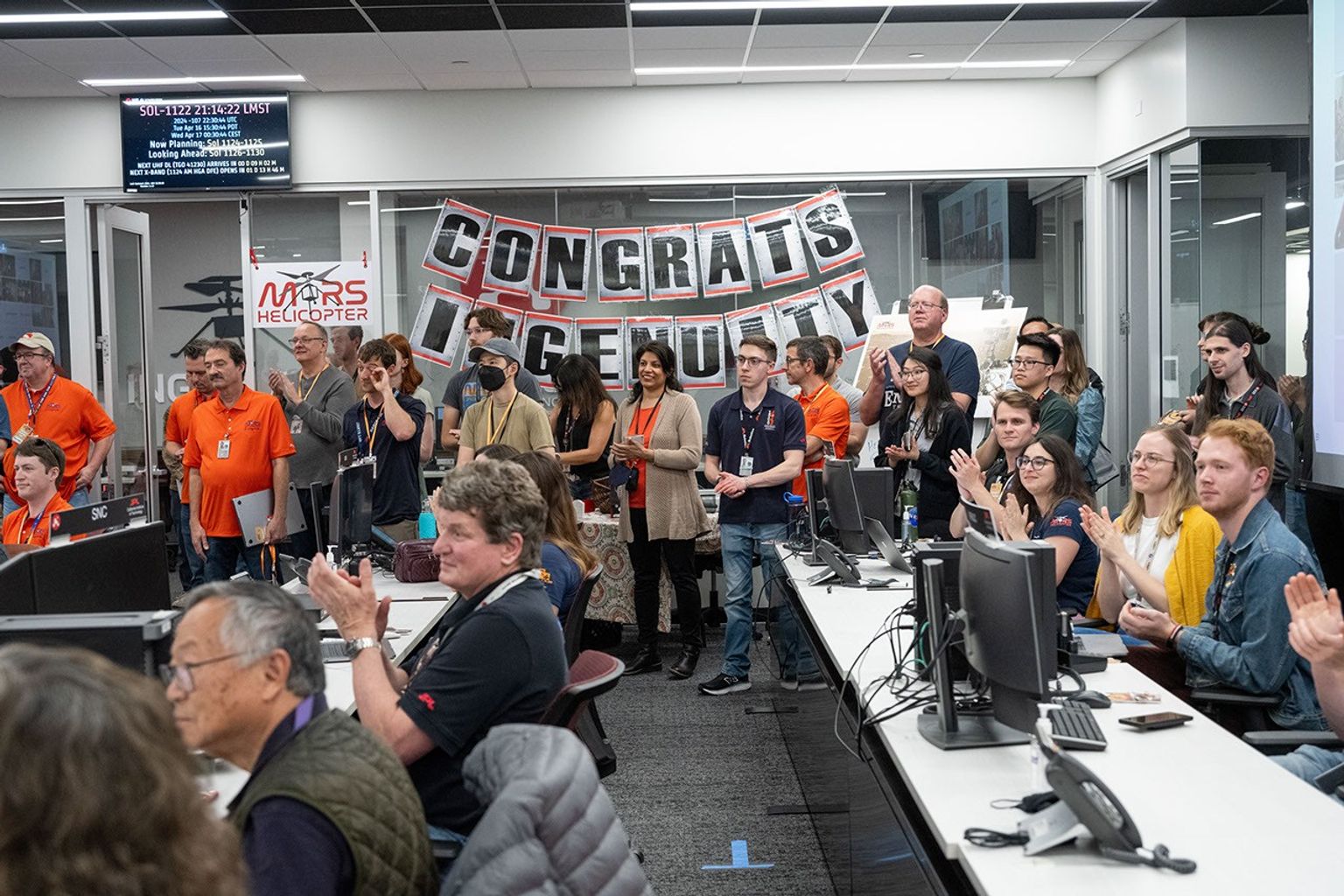 Engineers working on NASA's Ingenuity together monitored a transmission from the history-making helicopter in a JPL control room on April 16, 2024.