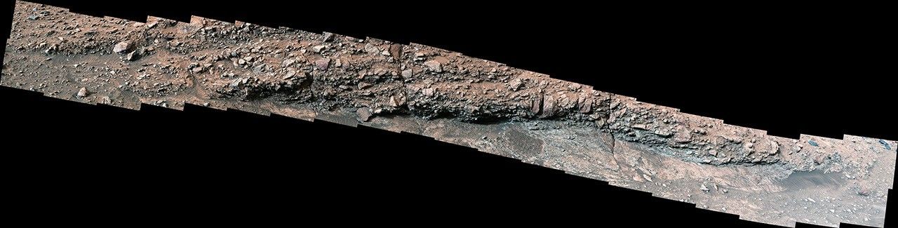 While exploring Gediz Vallis channel in May, NASA's Curiosity captured this image (Figure C) of rocks that show a pale color near their edges. When groundwater leaks into rocks along fractures, it causes chemical reactions that change the color.