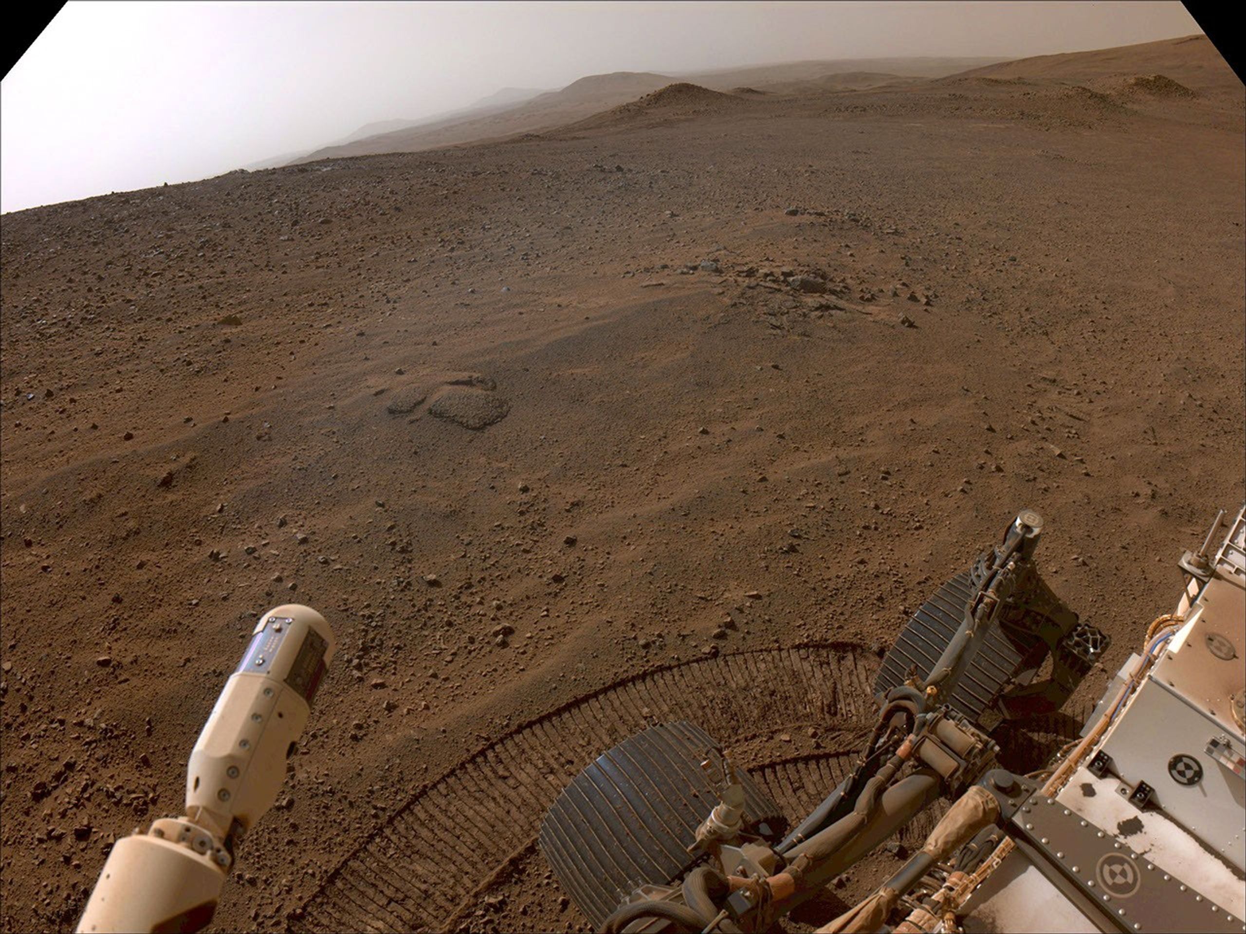 NASA's Perseverance Mars rover used its right-front navigation camera to capture this first view over the rim of Jezero Crater on Dec. 10, 2024.