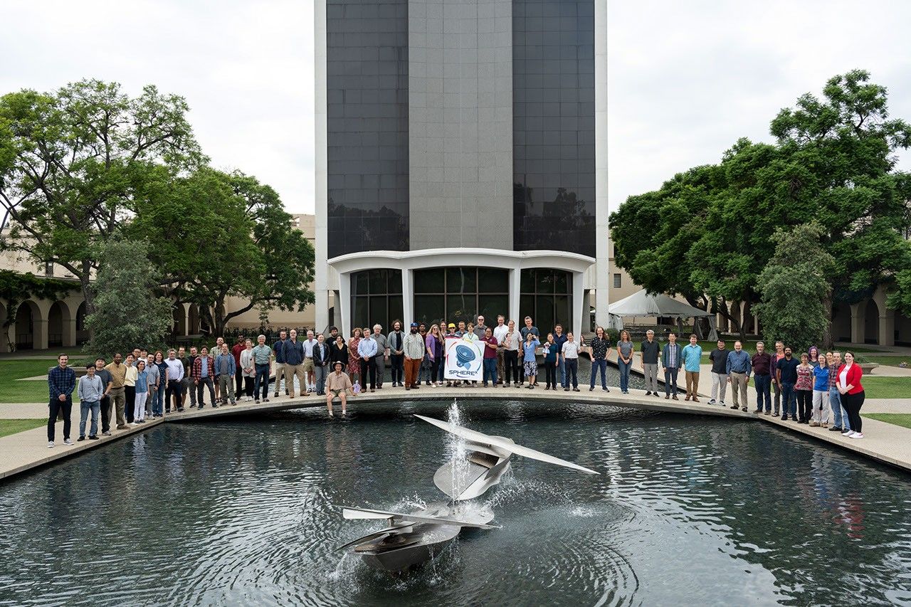 Members of the SPHEREx mission team pose for a photo on the campus of Caltech in Pasadena, California, in October 2023.