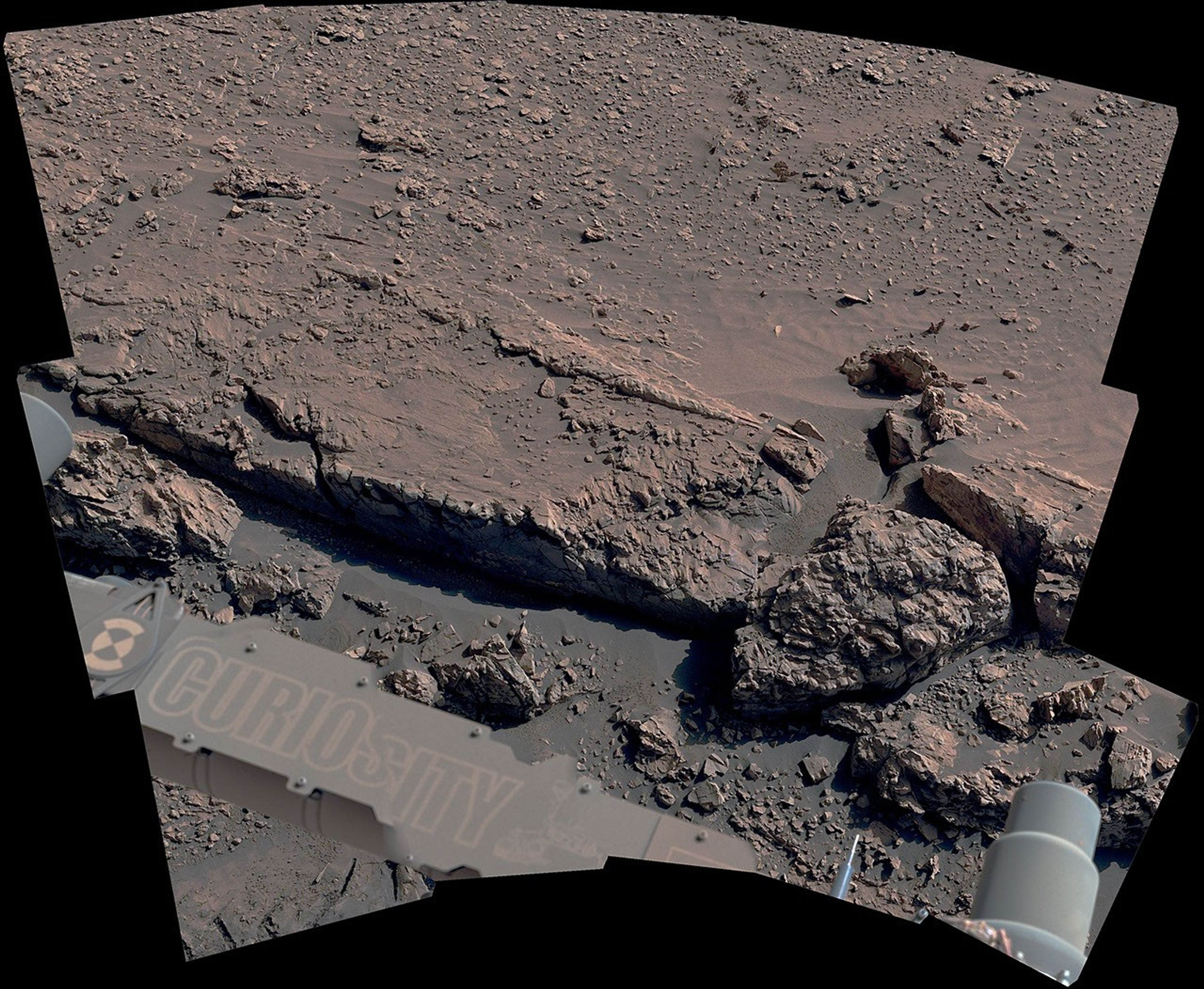 NASA's Curiosity Mars rover viewed this low ridge, which looks a bit like a crumbling curb, on May 16. Scientists think the hardened edges of such ridges may have been formed by ancient groundwater.