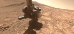 A dust devil whirled by in the distance as one of the cameras on NASA's Perseverance captured the Mars rover coring a sample near the rim of Jezero Crater on April 29, 2025.