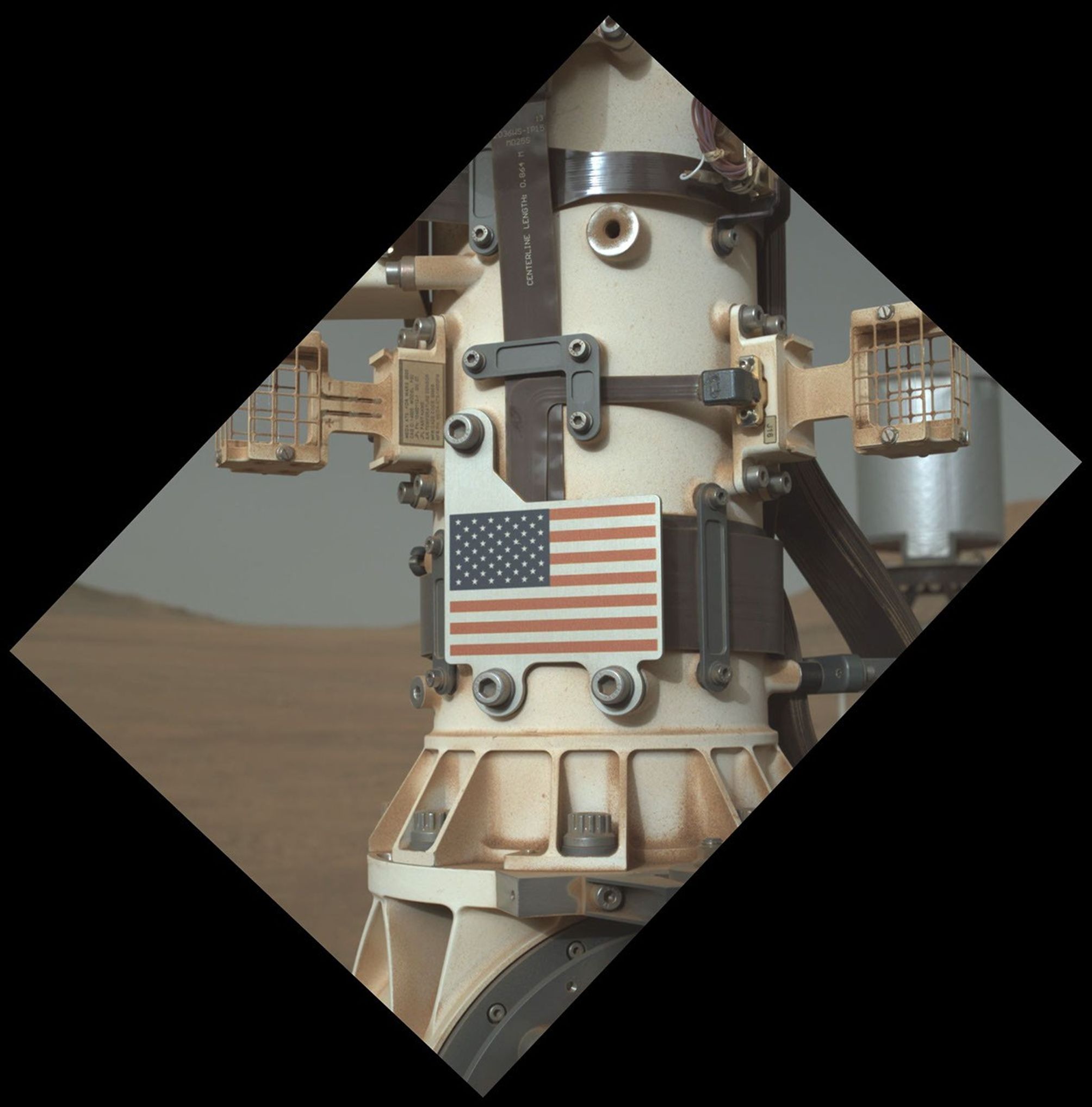 This close-up view of the United States flag plate on NASA's Perseverance was acquired on June 28, 2025, by the WATSON imager on the turret at the end of the rover's Mars robotic arm.