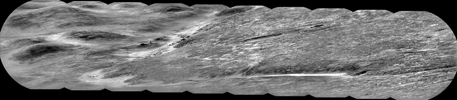 Dark rocky outcrops can be seen within Peace Vallis in a set of 10 images captured by NASA's Curiosity rover on Sept. 1, 2025.