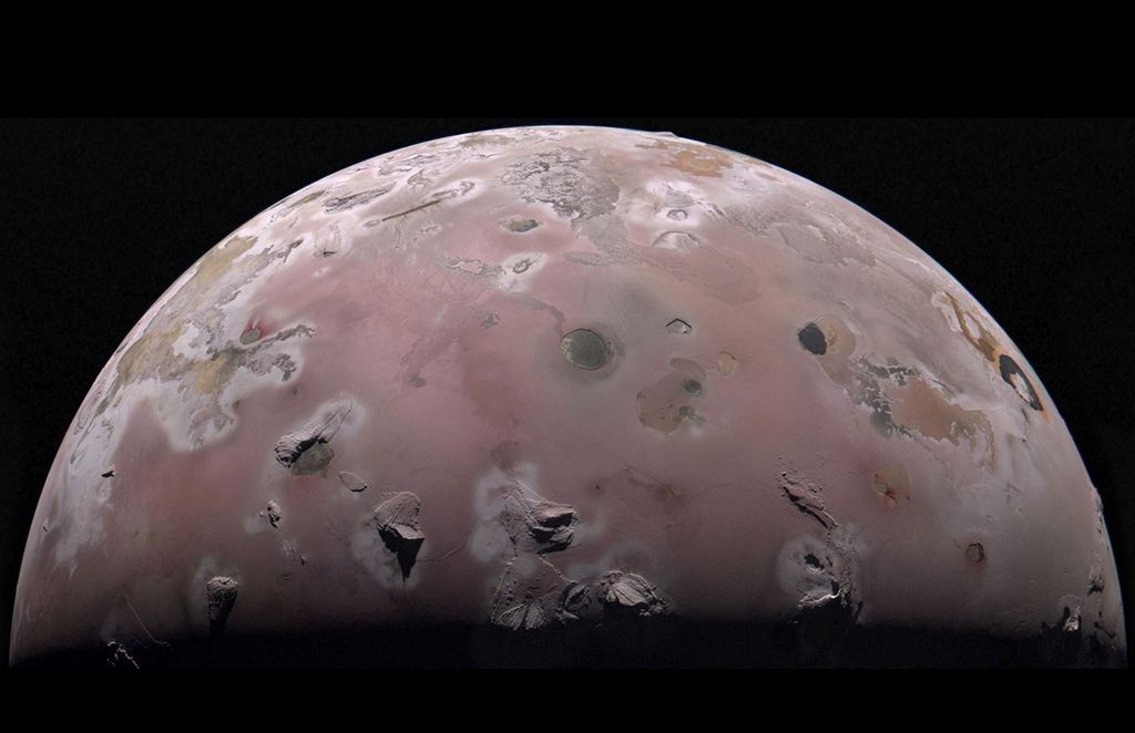 A reddish moon with lumps and splotches indicating volcanic activity.