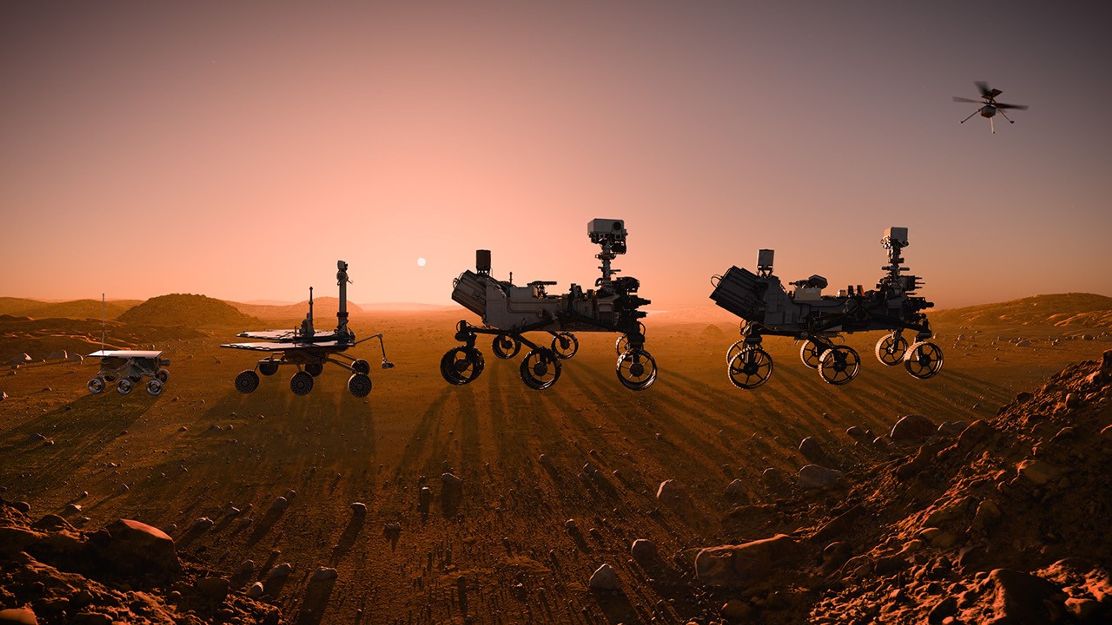 A realistic, animated video shows the progression of Mars rovers from a small microwave-sized Sojourner rover to the SUV-sized Perseverance rover. The final frame shows a sample return rocket liftin off from the Martian surface.