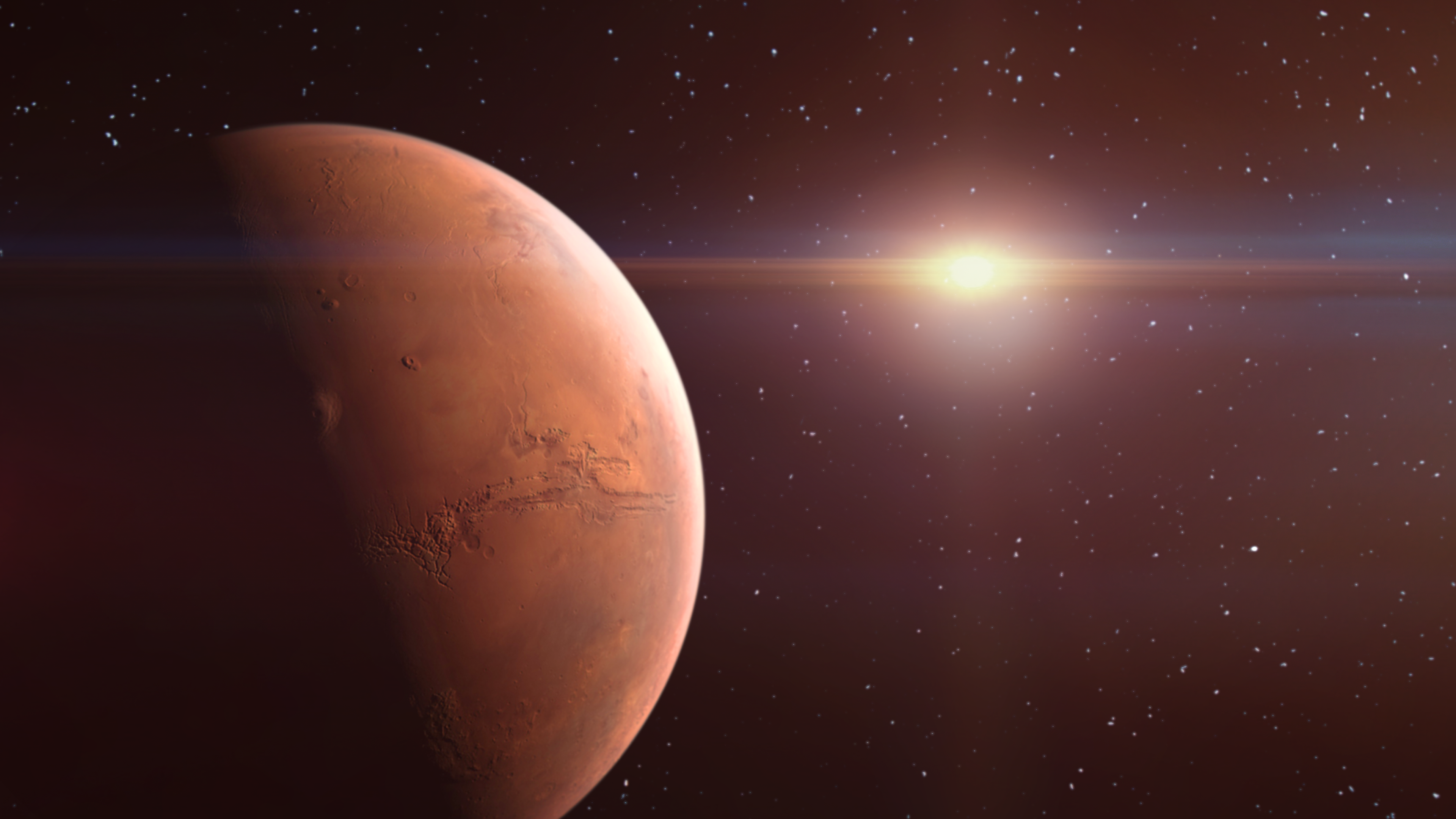 The limb of Mars in space is illuminated by the Sun.