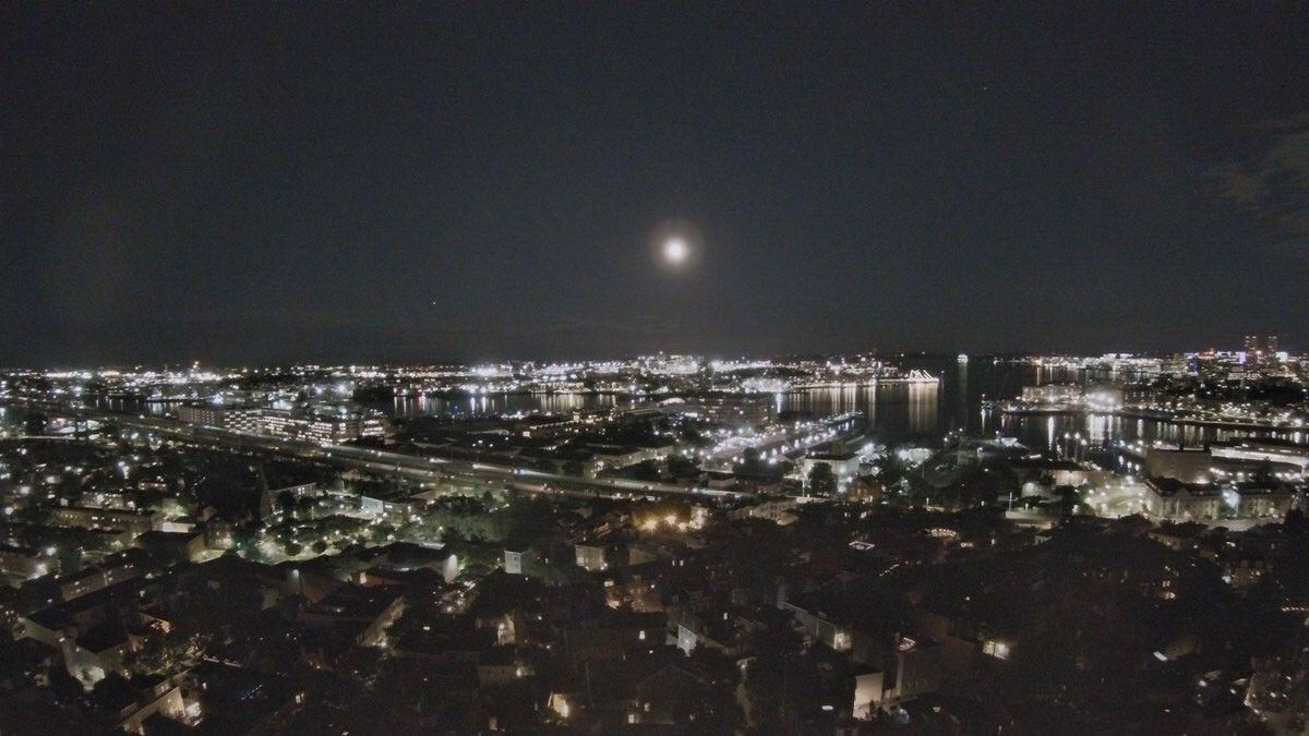 A full Moon hovers above Boston Harbor in this photograph taken from the top of the Bunker Hill monument.