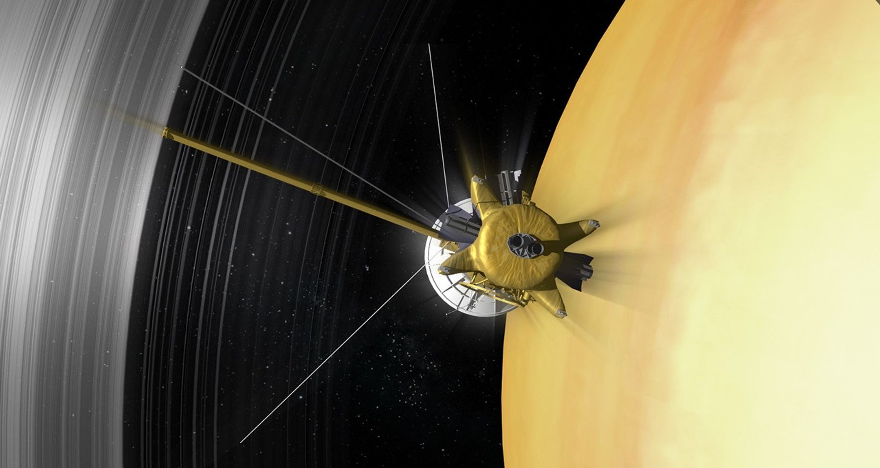 Illustration of Cassini speeding through the gap between Saturn and planet's the innermost rings.