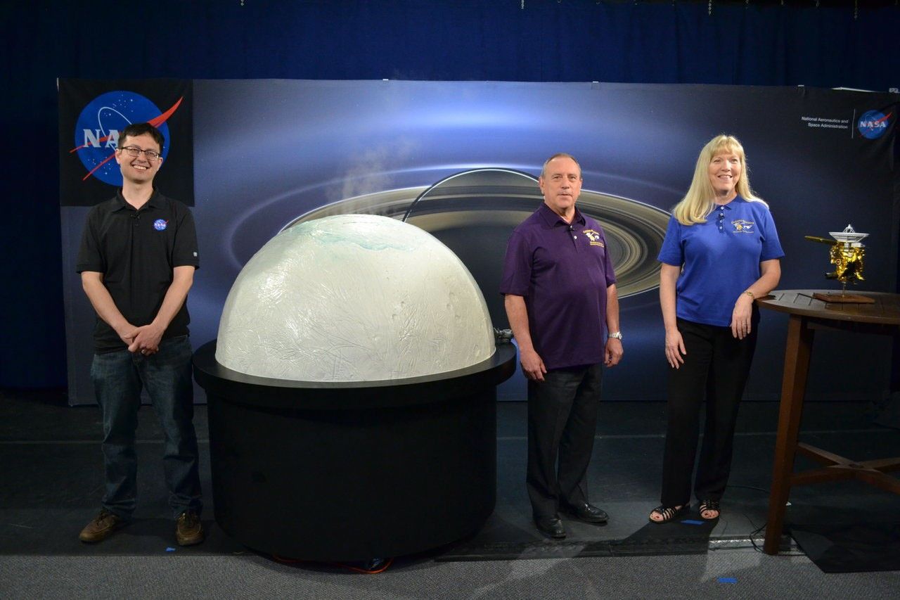 Artist's concept showing Cassini flying through the Enceladus plume.