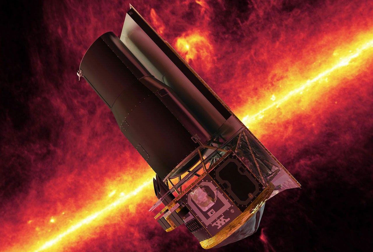 Rocket on launch pad seen in visible light (left) and glowing infrared light,  which shows heat (right).