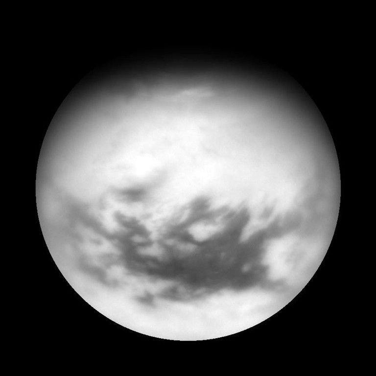 Titan's equatorial dark regions are visible in this view, along with faint, dark lineaments (linear features) in the otherwise bland-looking terrain of the north. Image taken April 13, 2007.