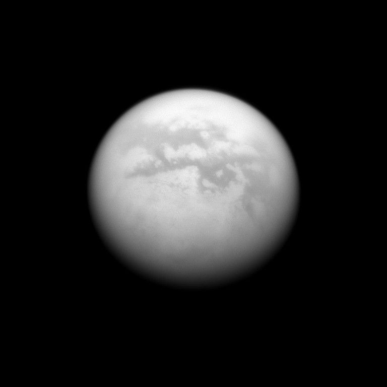The Cassini spacecraft charts a quartet of dark albedo features on the moon Titan. From upper left to lower right of the image are Fenzal, Aztlan, Aaru and Senkyo. Image taken June 9, 2009.