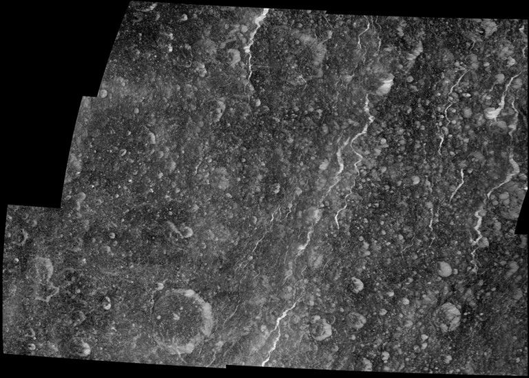 Icy fractures on Saturn's moon Rhea reflect sunlight brightly in this high-resolution mosaic created from images captured during Cassini's March 2, 2010, flyby. This was the closest flyby of Rhea up to then.