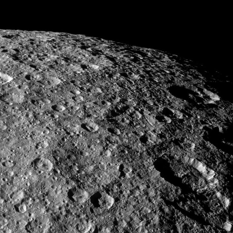 Cassini looks over the heavily cratered surface of Rhea during the spacecraft's flyby of the moon on March 10, 2012.