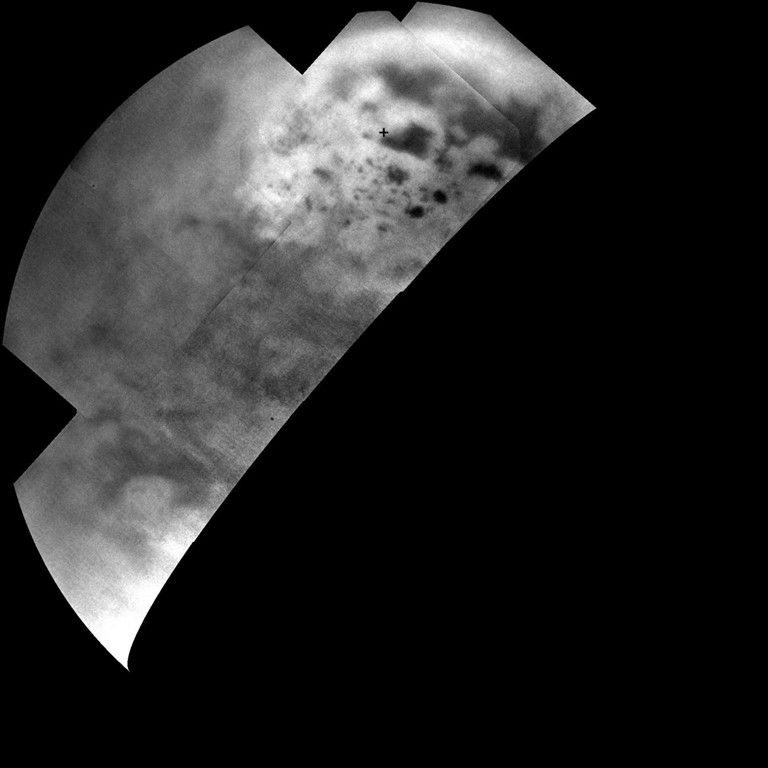 Ultracold hydrocarbon lakes and seas (dark shapes) near the north pole of Saturn's moon Titan can be seen embedded in some kind of bright surface material in this infrared mosaic from NASA's Cassini mission.