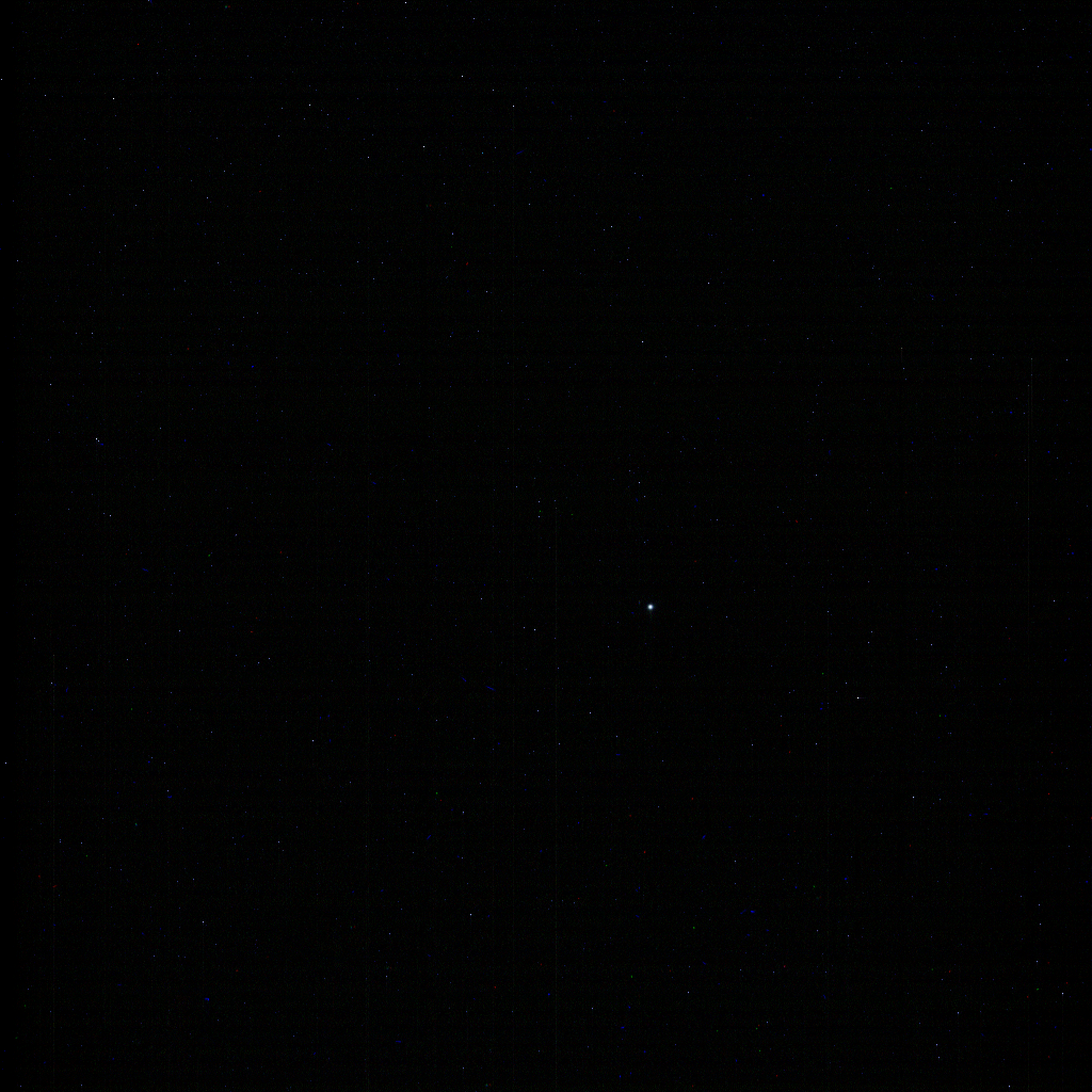 Neptune appears in this natural color composite (Figure A) as a pale blue disk, just below and to the right of image center. Image Credit: NASA/JPL-Caltech/Space Science Institute