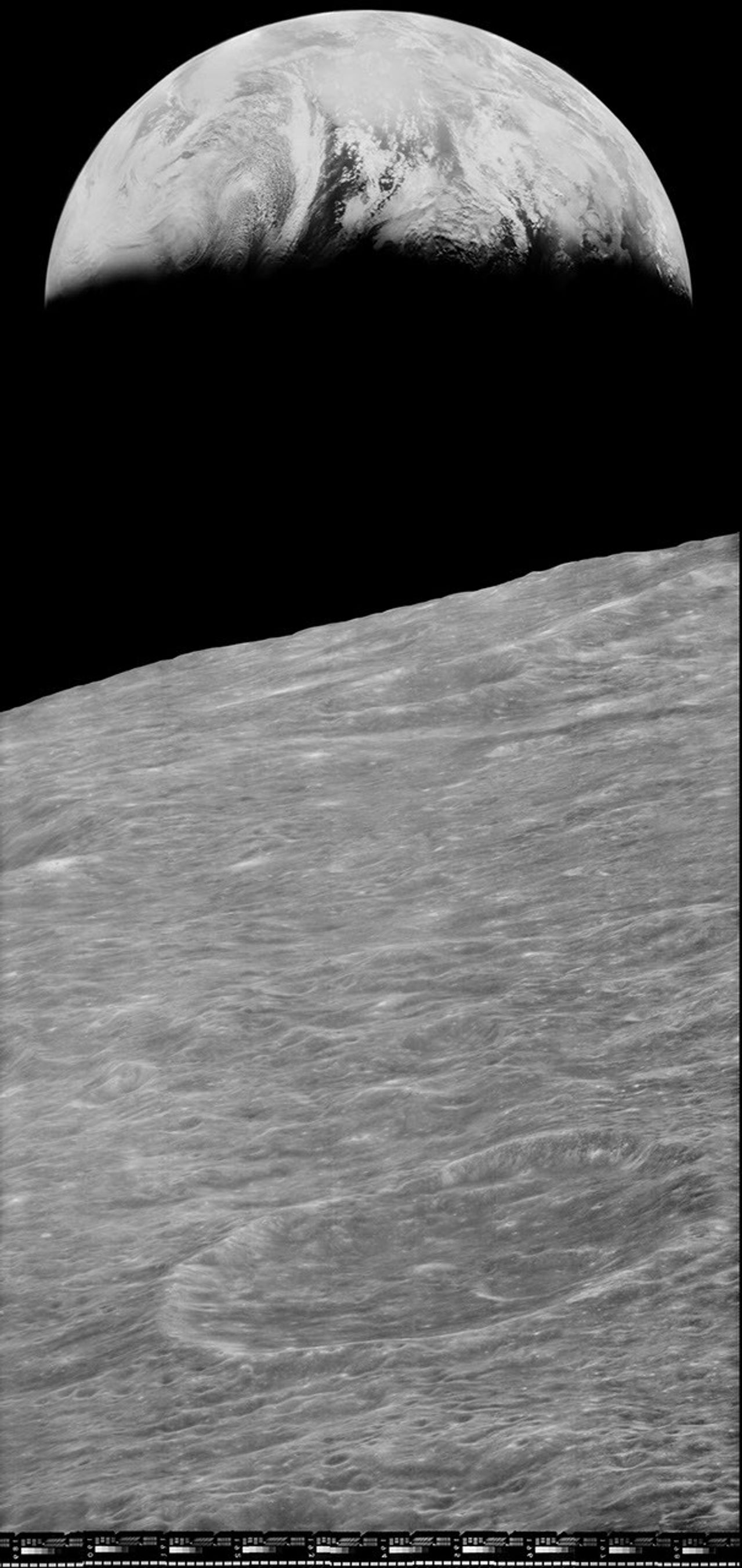 Earth rising above the moon.
