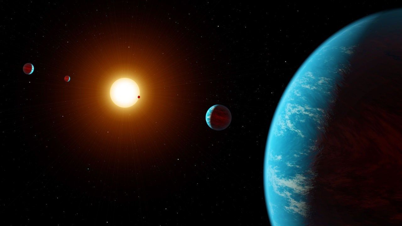 Illustrations of planets around distant star.