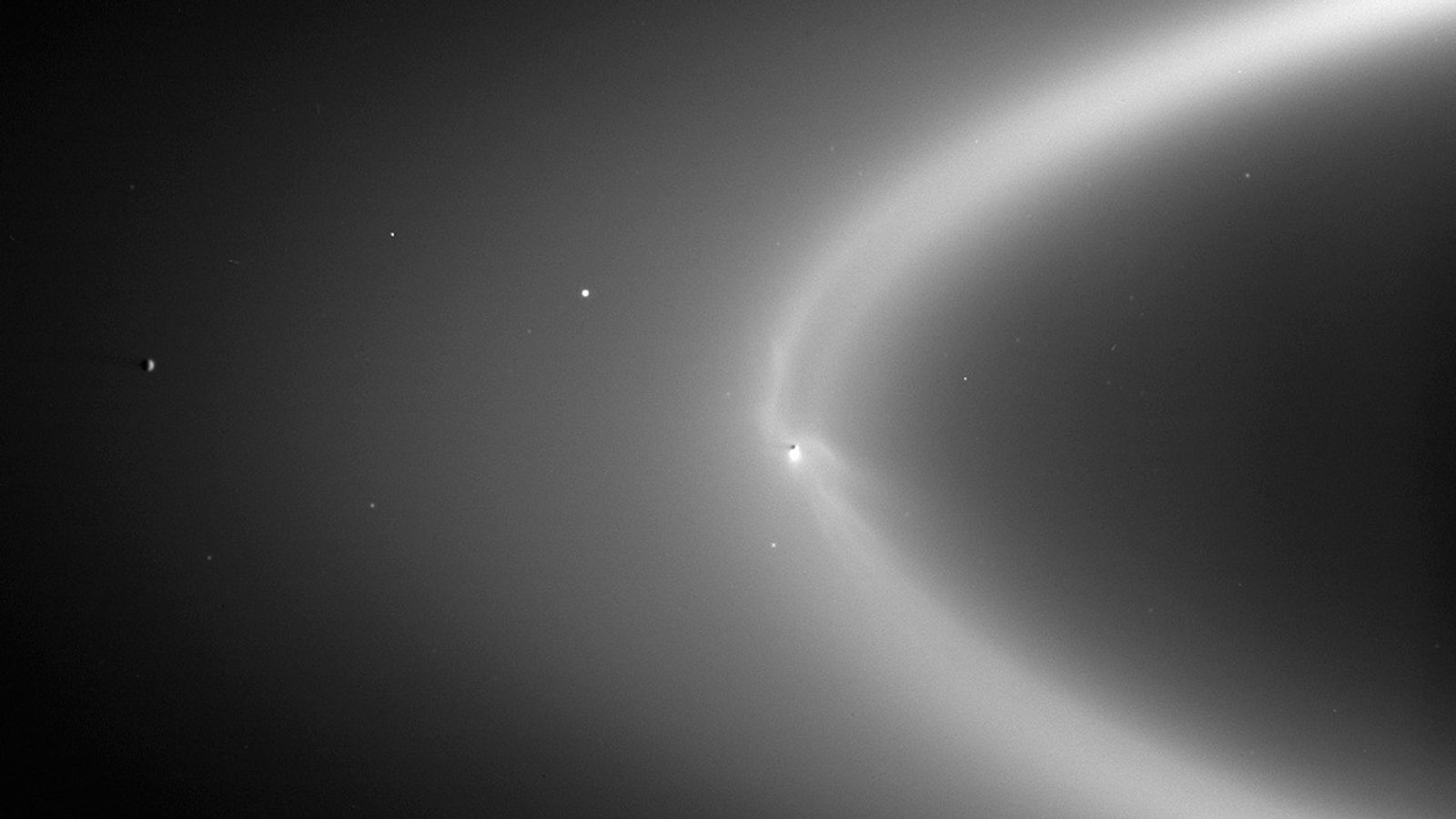 Black and white image of dusty rings at Saturn.