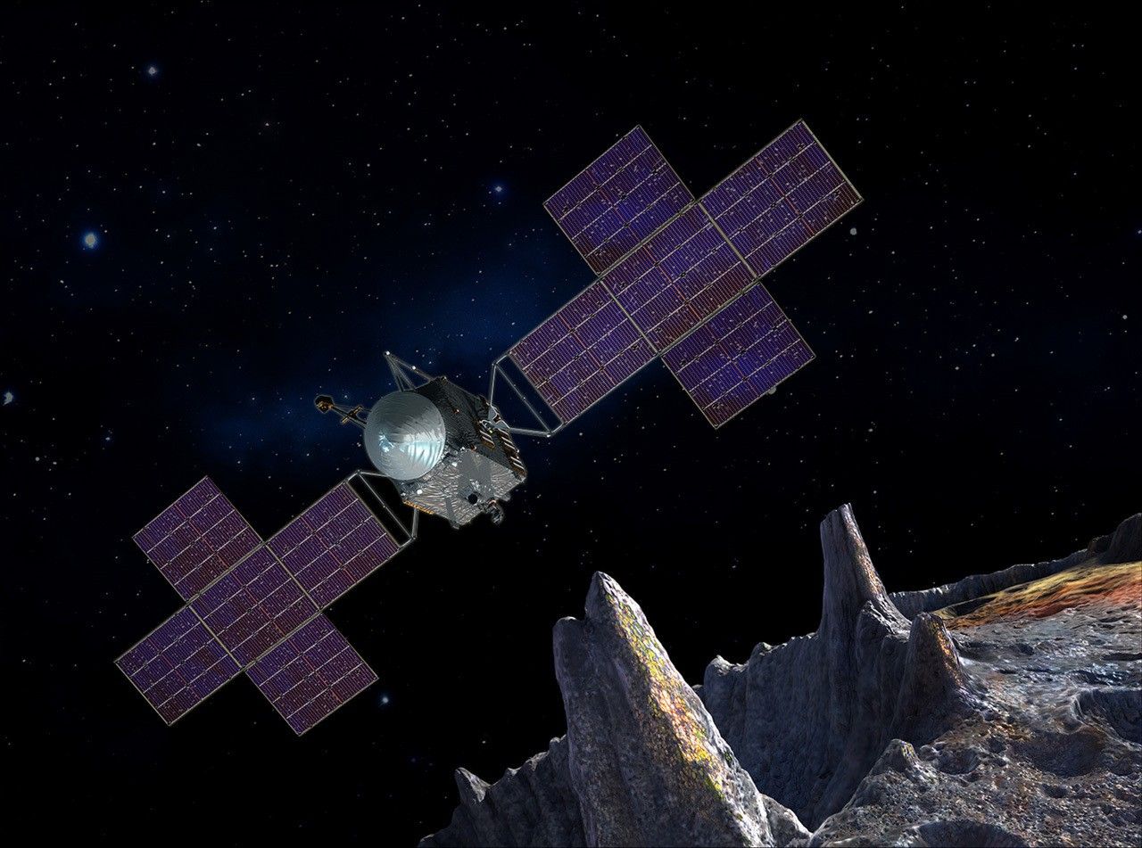 Spacecraft over asteroid.