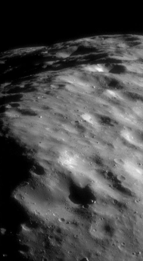 Black and white view of surface features on asteroid Eros