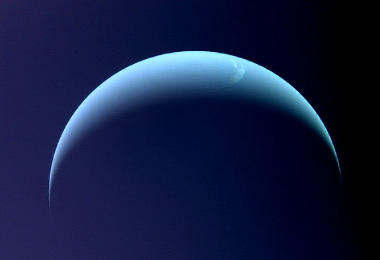 A light blue crescent shape with a darker blue background.