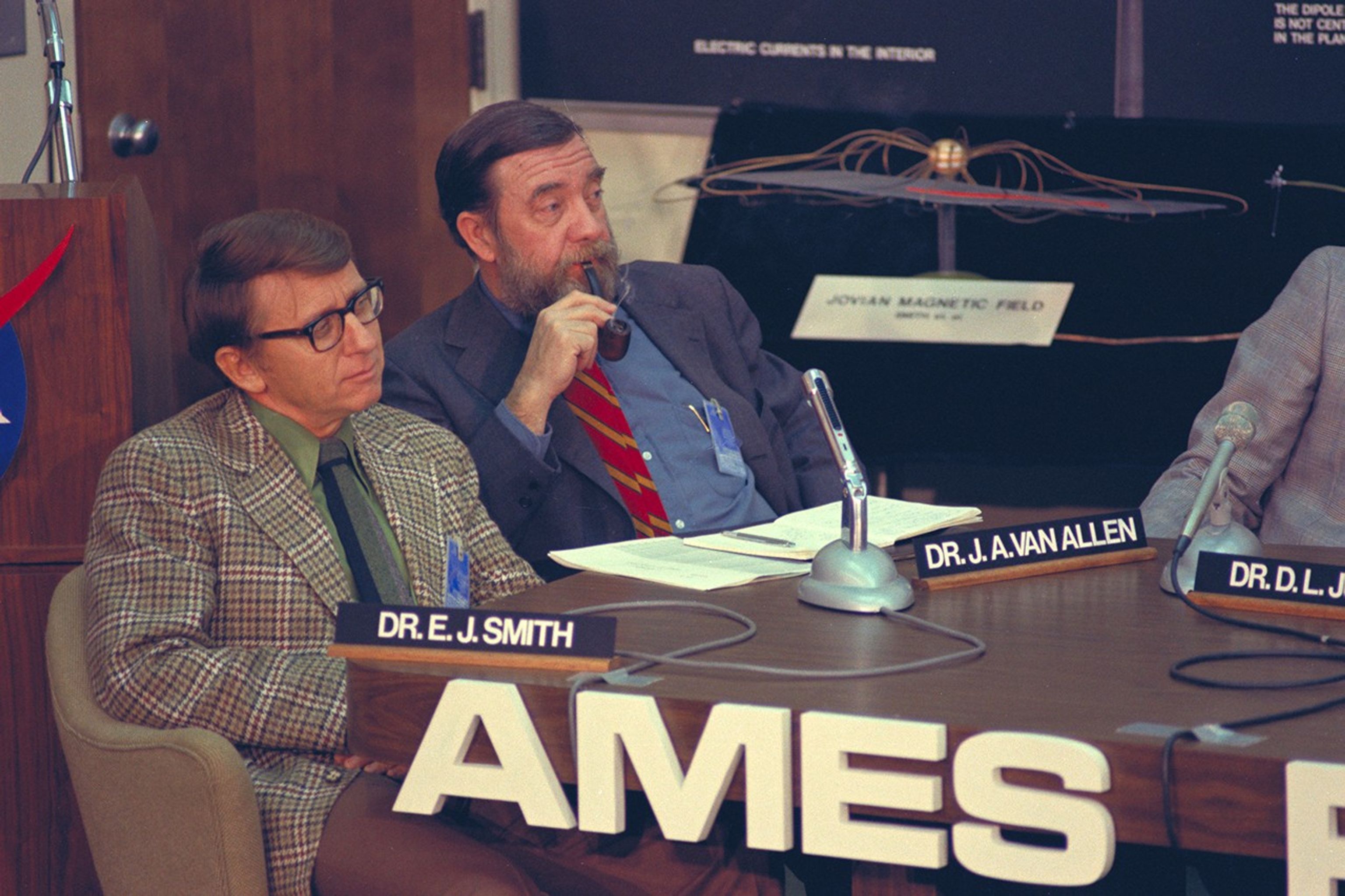 Two met at conference table.