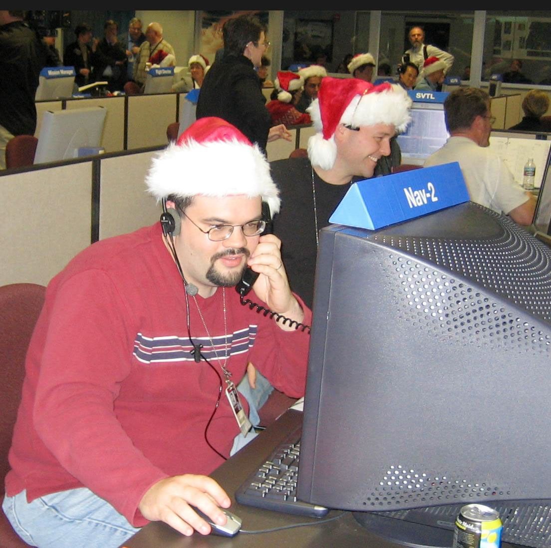 Members of the Cassini Navigation Team track Cassini.