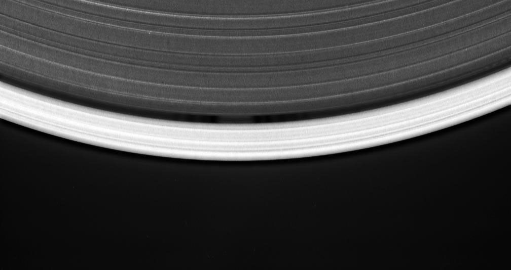 This movie sequence consists of 12 images taken over 16 minutes while Cassini gazed down upon the sunlit side of the A ring, shows a tiny moon orbiting in the center of the Keeler gap, churning up waves in the gap edges as it goes.