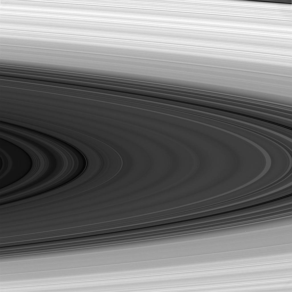 The fine lines of Saturn's rings are visible in this black and white image.