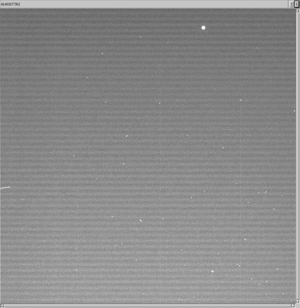 Black and white image shows Huygens Probe as a bright dot against a black background.