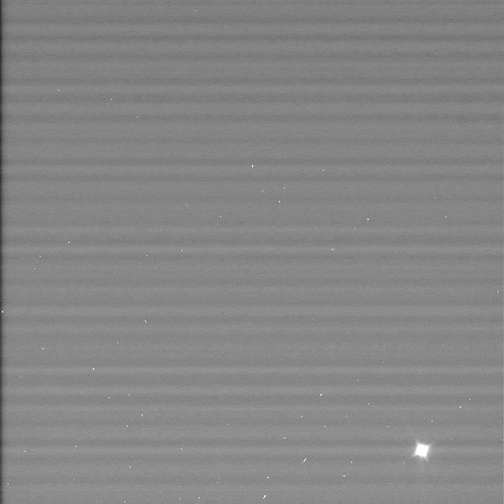 Black and white image shows Huygens Probe as a bright white flare in lower right of image.