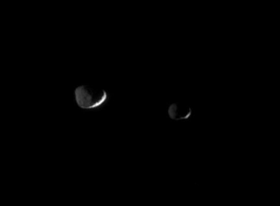 Epimetheus and Janus floating in space
