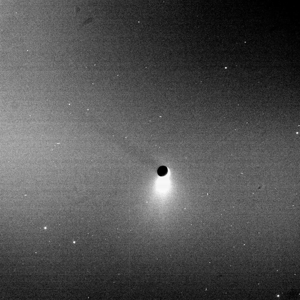 The plume of Enceladus shines in scattered sunlight