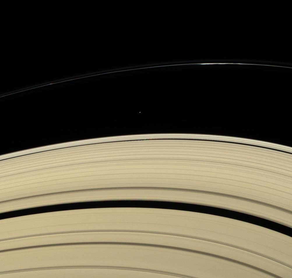 Saturn's rings and two small moons: Atlas and Daphnis