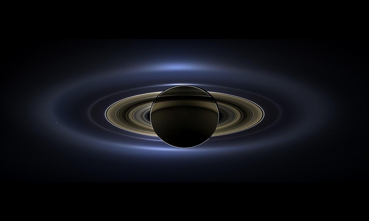 On July 19, 2013, in an event celebrated the world over, NASA's Cassini spacecraft slipped into Saturn's shadow and turned to image the planet, seven of its moons, its inner rings -- and, in the background, our home planet, Earth.