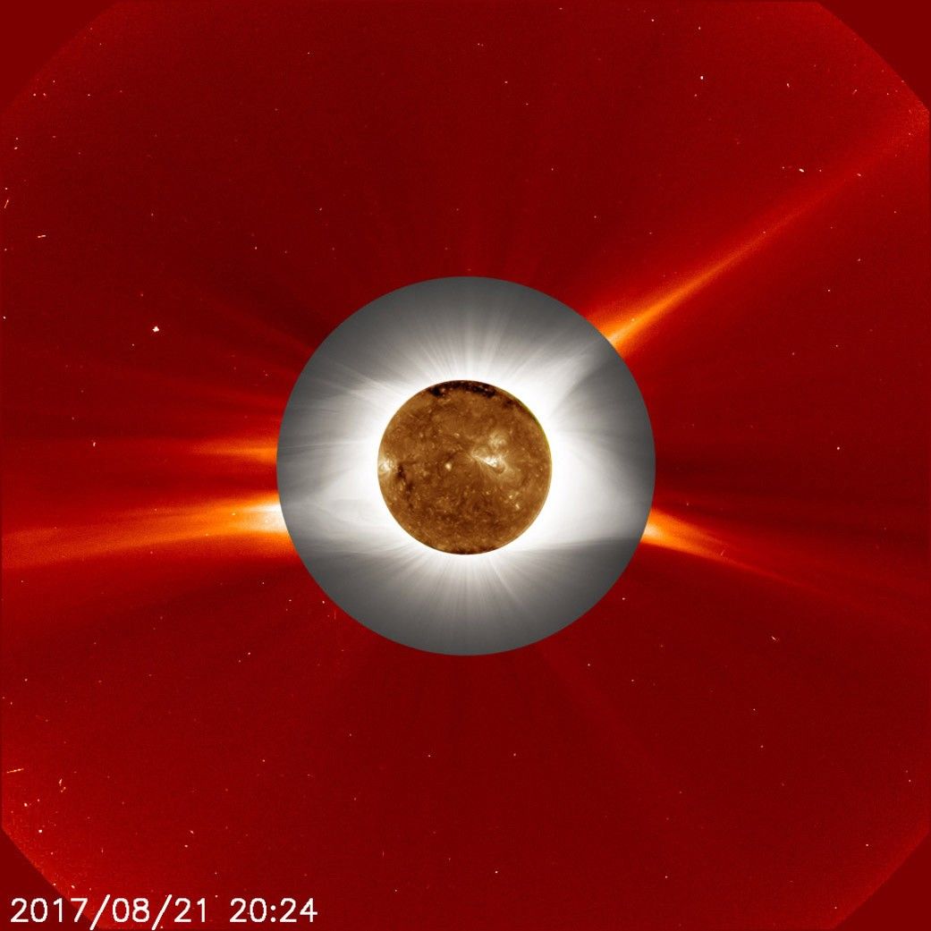 A golden circle, surrounded by a gray circle, surrounded by a red circle. This is a coronograph, revealing the Sun's atmosphere.