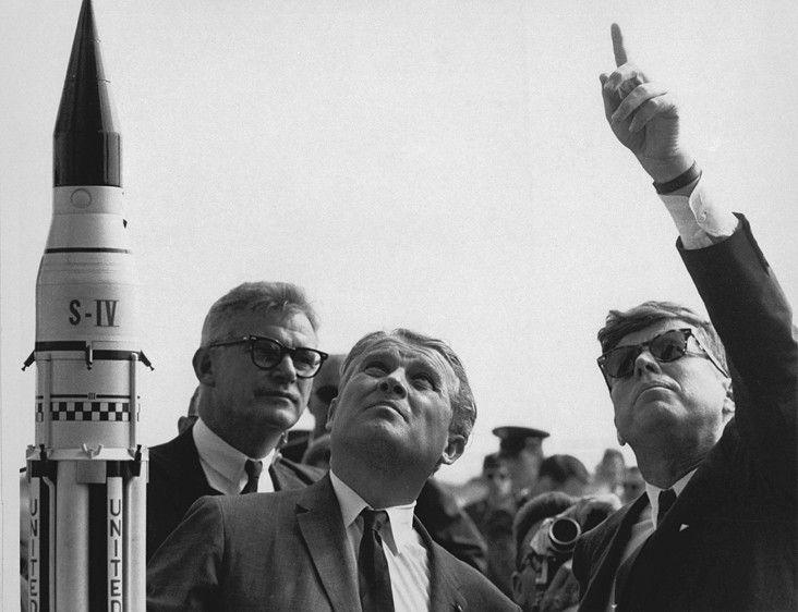 Dr. Wernher von Braun explains the Saturn V Launch System to President John F. Kennedy.
