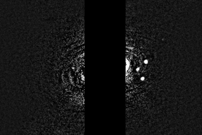 Faint image showing moons of Neptune.