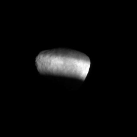 Sunlight passing through the Cassini Division between Saturn's A and B rings sweeps across and illuminates the surface of the moon Janus in this movie captured shortly after Saturn's August 2009 equinox.