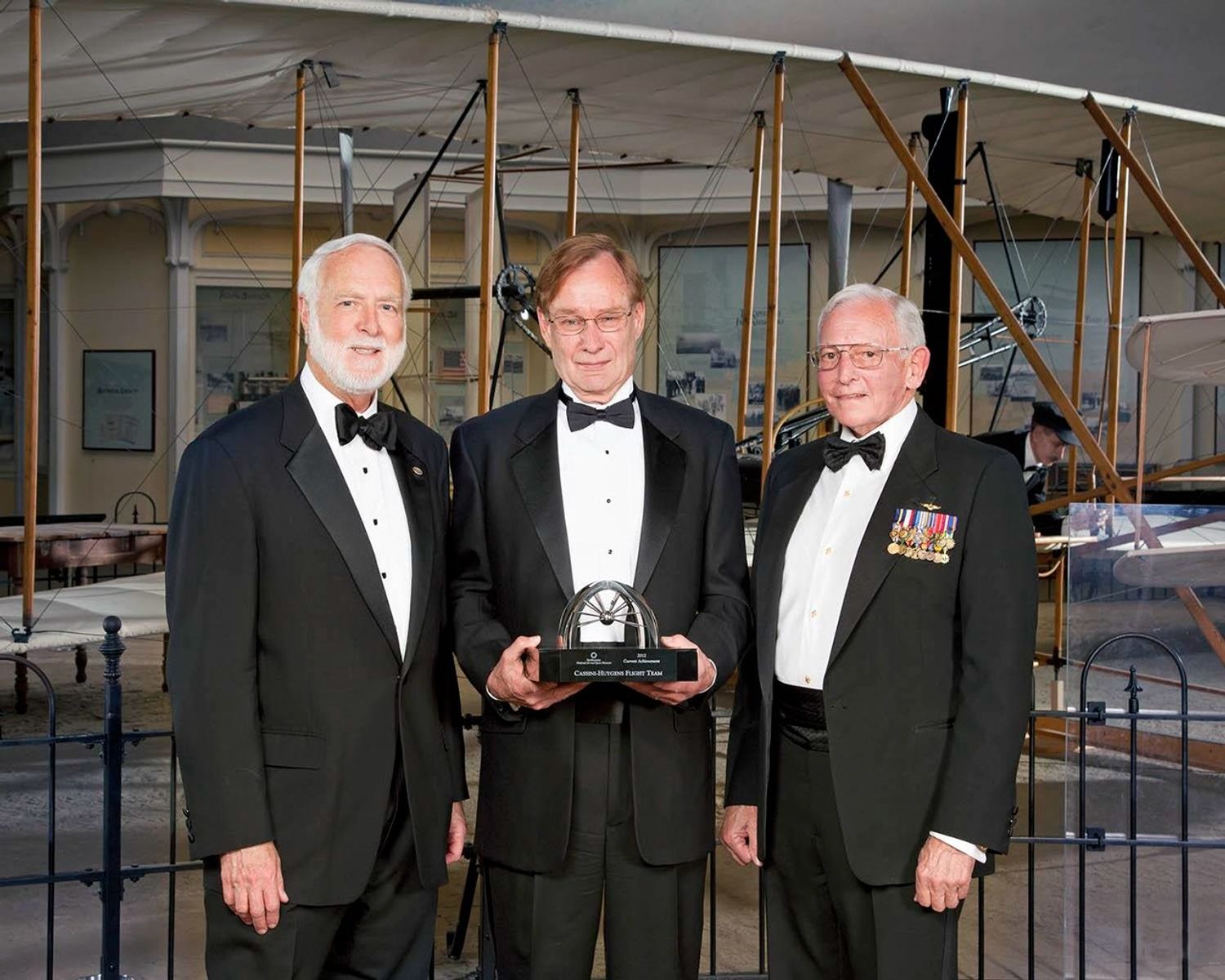 Wayne Clough, secretary of the Smithsonian; Robert Mitchell, Cassini program manager based at NASA's Jet Propulsion Laboratory, Pasadena, Calif.; and Gen. Jack Dailey, director of the National Air and Space Museum.