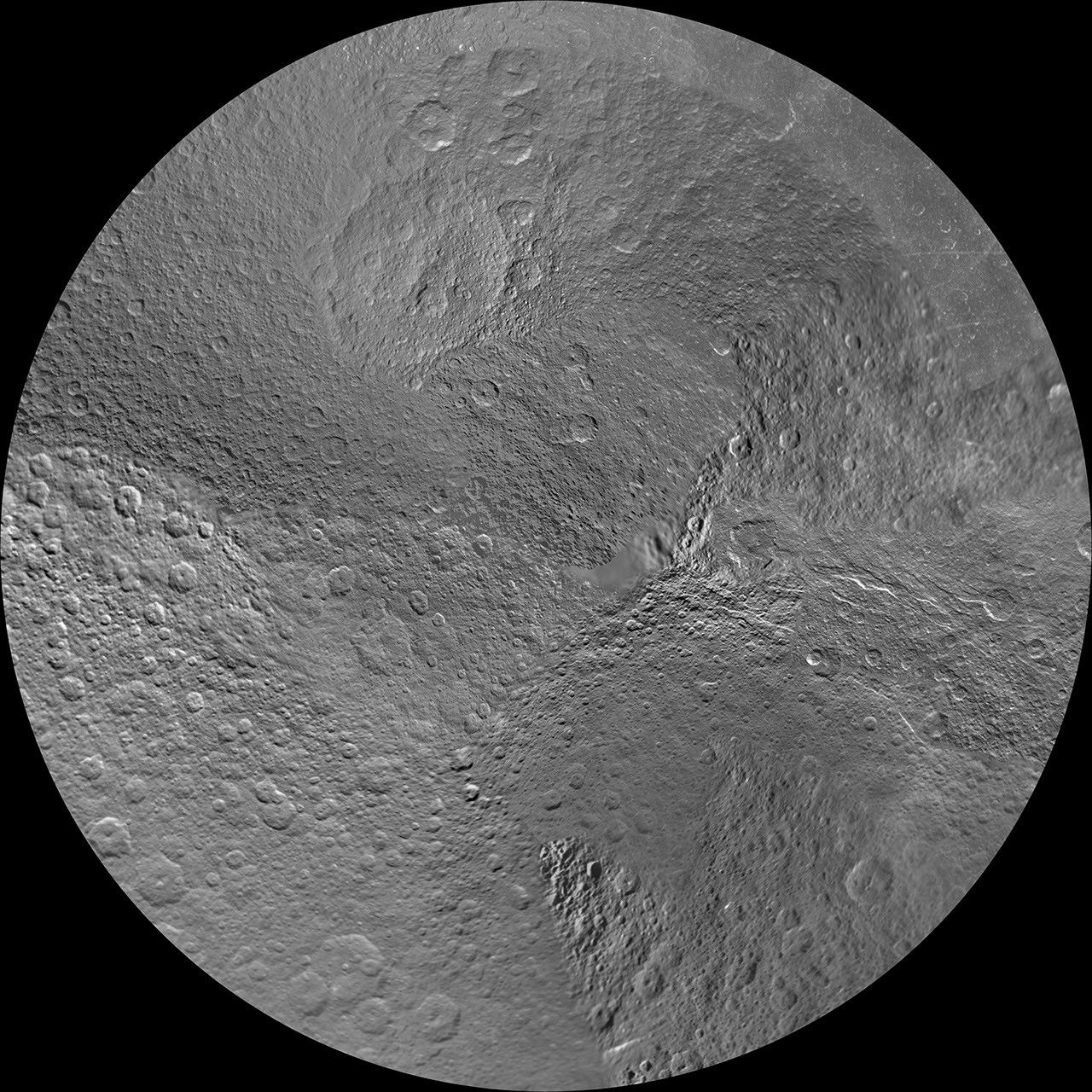 The northern and southern hemispheres of Rhea are seen in these polar stereographic maps, mosaicked from the best-available Cassini and Voyager images.
