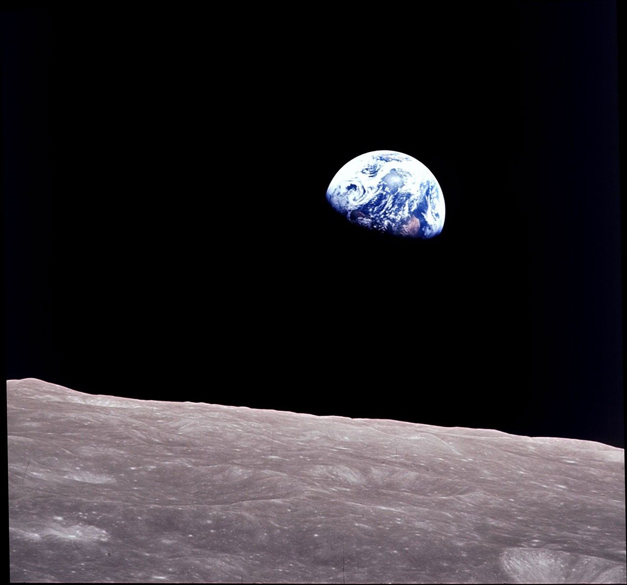 View of rising Earth about five degrees above the Lunar horizon