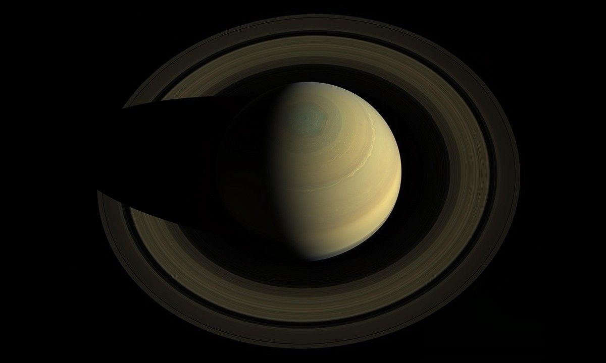 A swing high above Saturn by NASA's Cassini spacecraft revealed this stately view of the golden-hued planet and its main rings.
