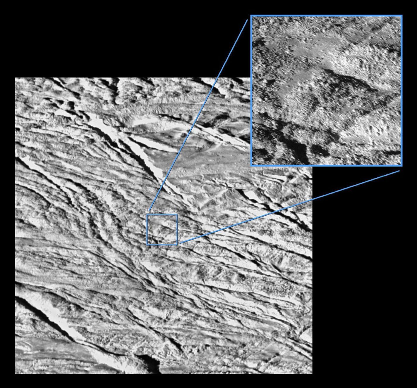 Two views of Enceladus: one, larger view is of lower resolution; the smaller inset view is of higher resolution