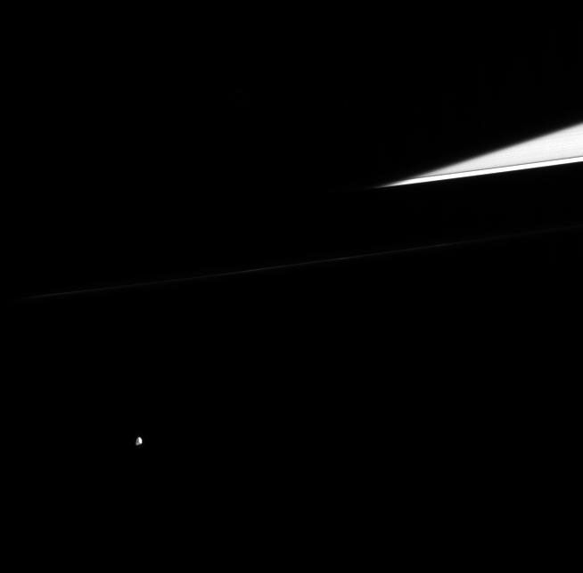 an image of the moon Epimetheus with Saturn's rings in the background