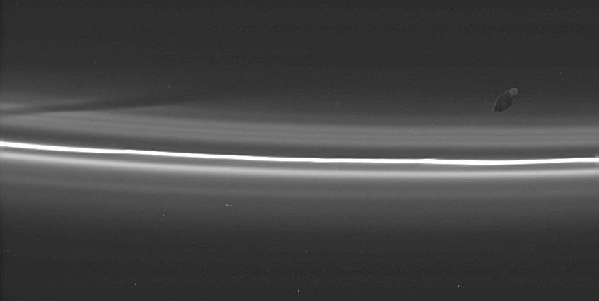 an image of Prometheus with Saturn's F ring in the background