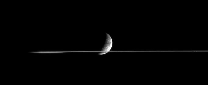 Dione and a portion of Saturn's rings