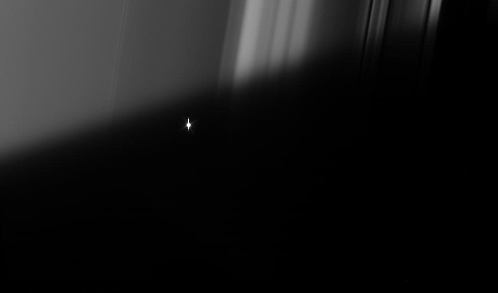 The bright red giant star Aldebaran slip behind Saturn's rings